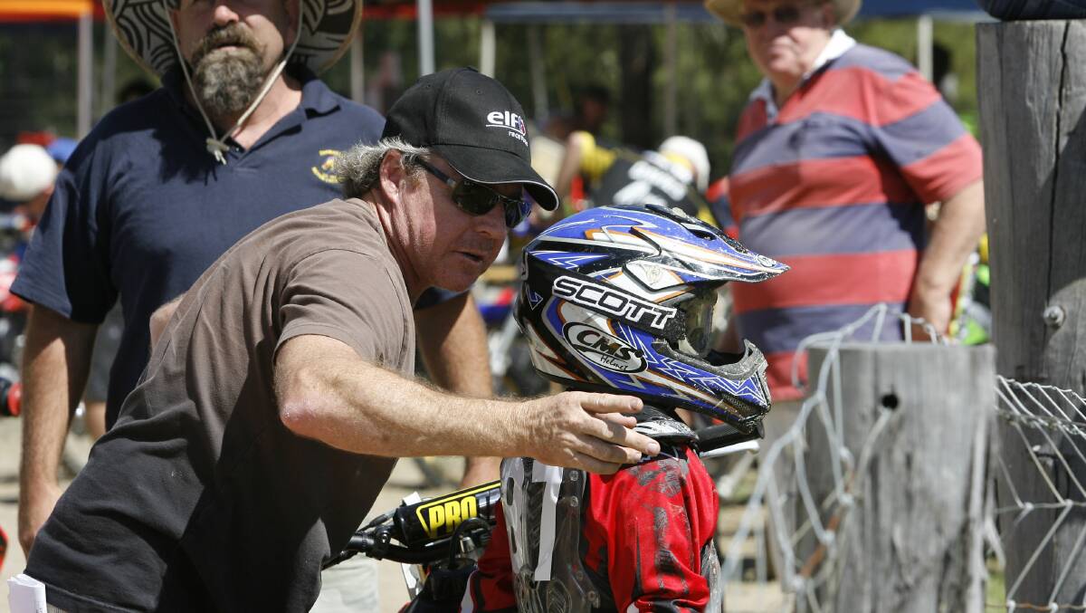 Wayne Gardner gives son Remy a few pointers before a race in Newcastle. Picture: Darren Pateman