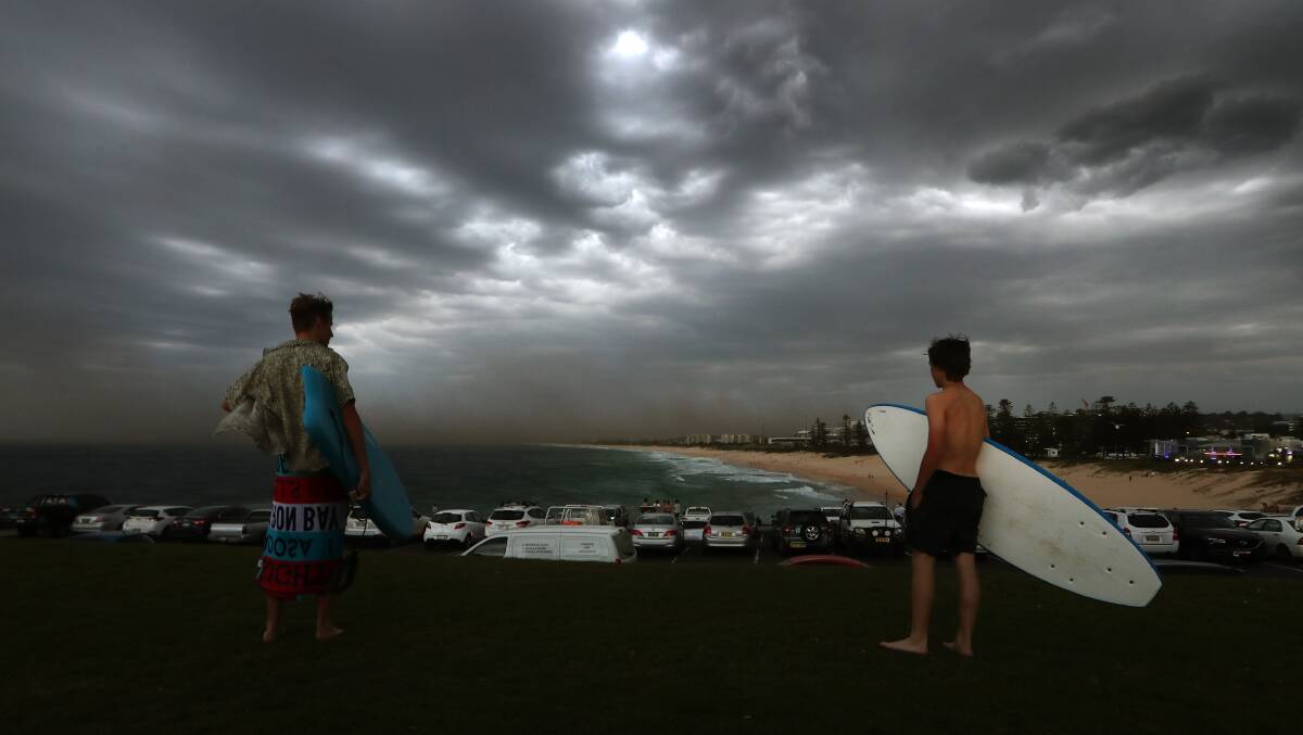 Dark clouds over Wollongong's City Beach on Friday evening. Photo: Sylvia Liber