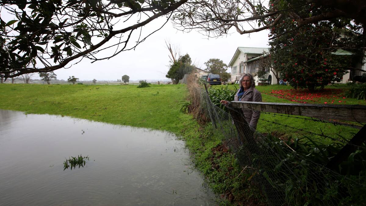 Moss Street resident Valda Goodsell surveying the effects of heavy rains on her property on Monday. 