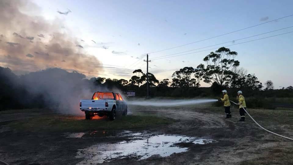 A ute was destroyed by fire near Hyams Beach. Photo: NSW Rural Fire Service St Georges Basin Brigade