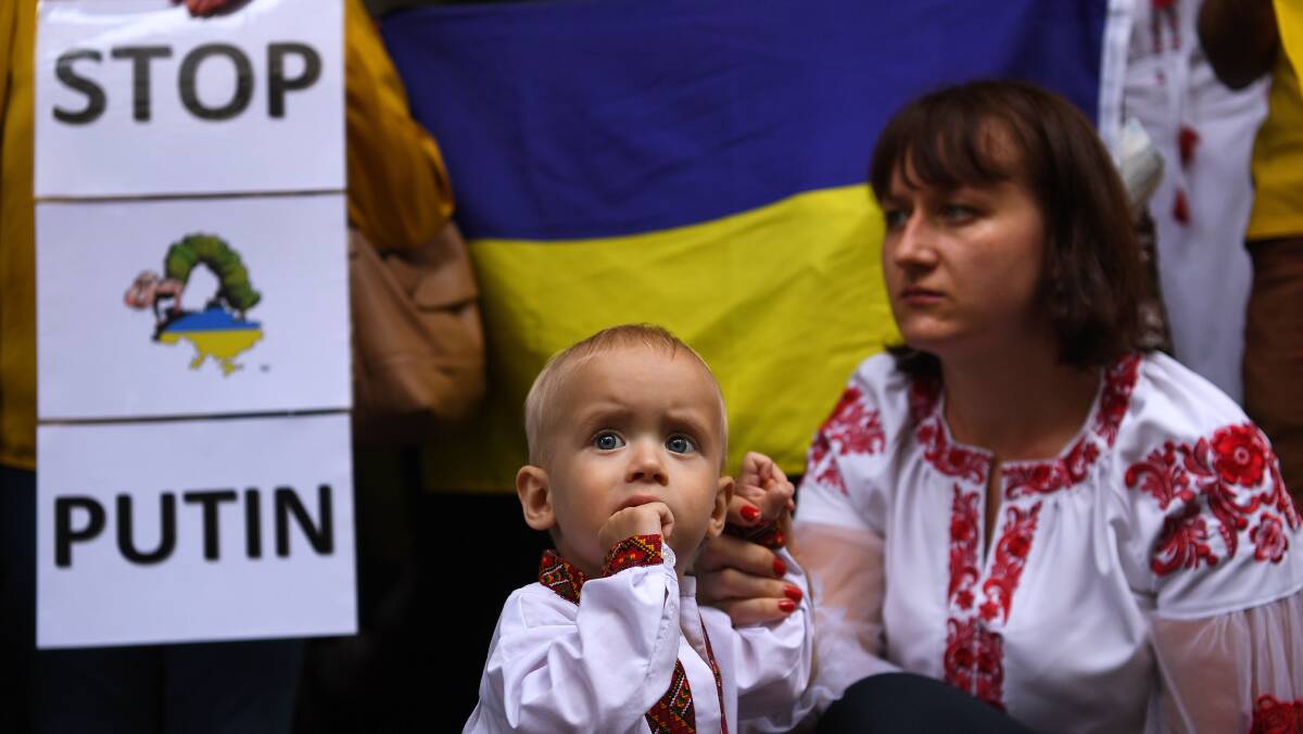 Protesters at a rally against the war in Ukraine at Martin Place in Sydney. Photo: AAP