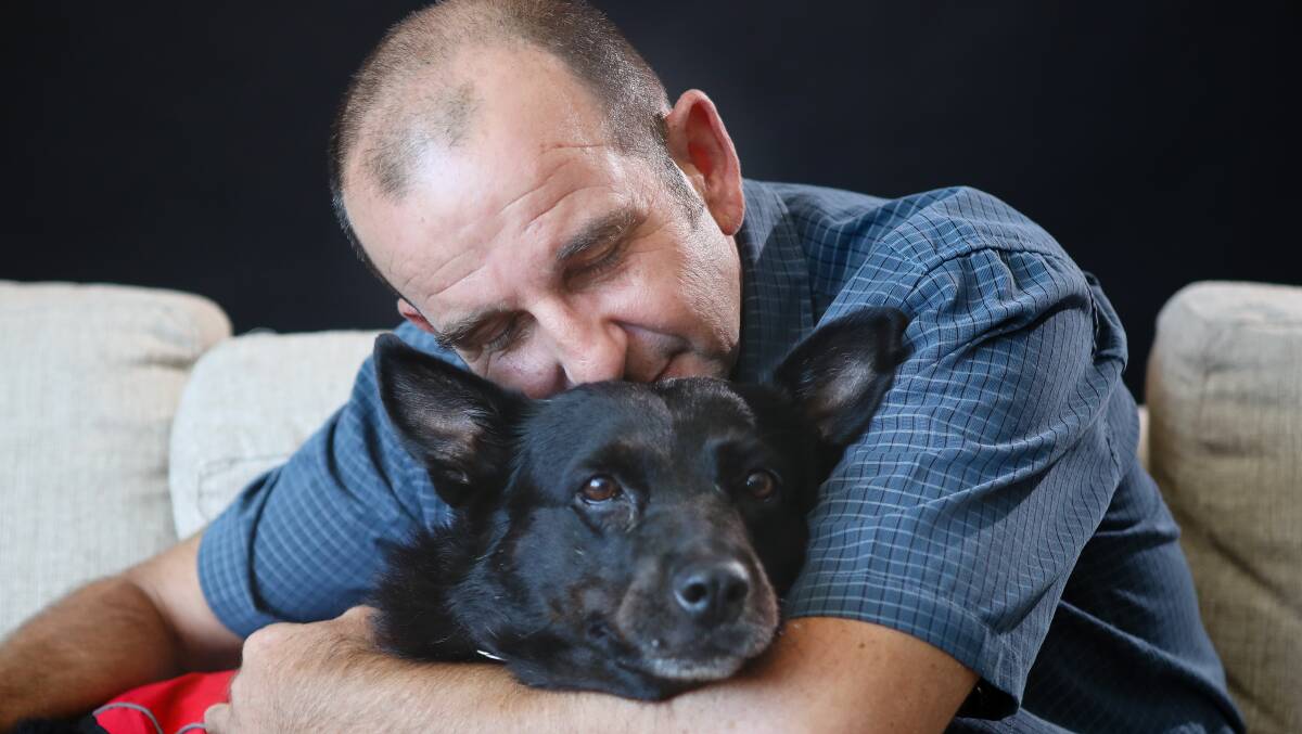David Simms with his support dog Digger. Photo: Adam McLean