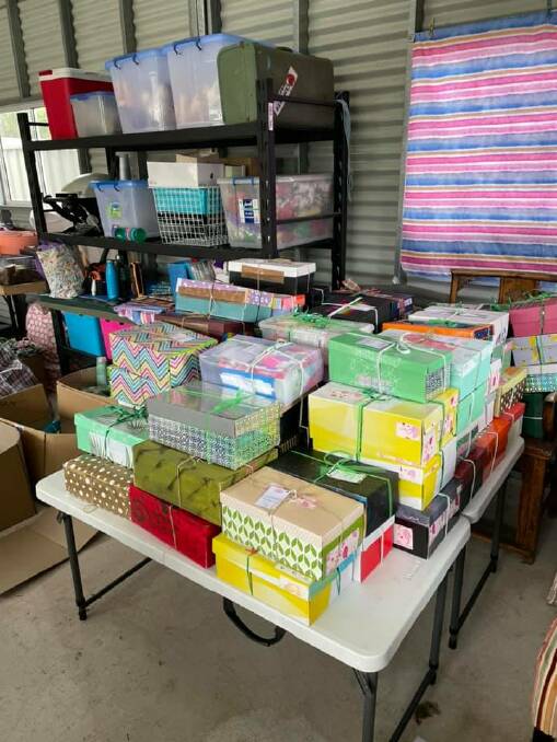 The Quotarians collected 300 shoeboxes, which were all lovingly decorated by Oak Flats High students, the Men's Shed in Kanahooka and other members of the community.