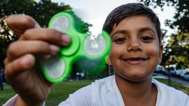 Mesmerising or irritating? The fidget spinner is the latest craze for children and teenagers.  Photo: Brook Mitchell
