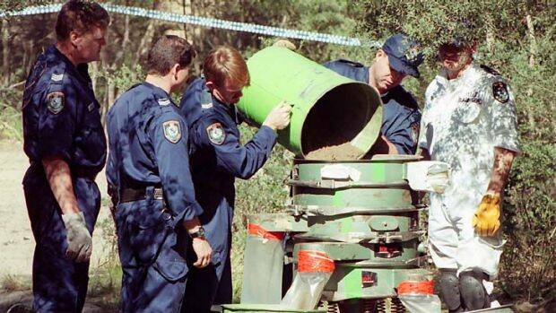 Police inspect the crime scene in September 1997 where Jodie Fesus' body was found. Photo: Orlando Chiodo
