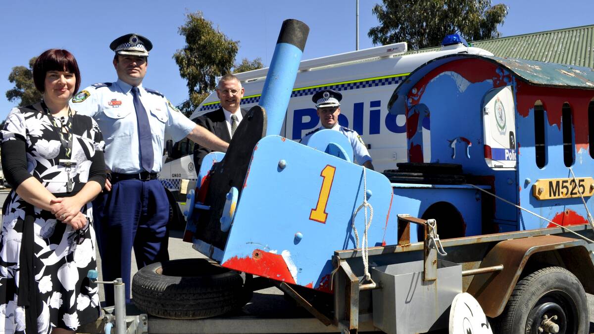 Recovered in drug bust: Goulburn Supt Quarmby and Detective Inspector Chad Gillies were proud to give back missing Thomas the Tank Engine to Mayor Geoff Kettle and council's Julianne Salway.