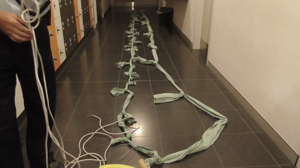 The rope, made of torn strips of bedsheet, was allegedly intended to hoist two inmates to freedom. Photo: Corrective Services