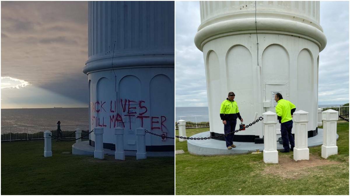 Council workers paint over the Black Lives Still Matter spray paint on Tuesday.