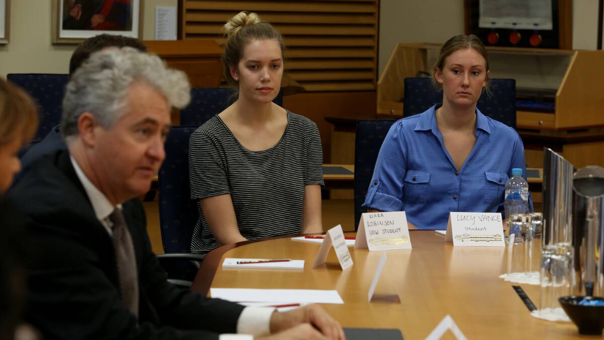 Underpaid worker Lucy Vance, 19 (right) and Labor's Adam Searle during Tuesday's exploitation roundtable. Picture: Robert Peet