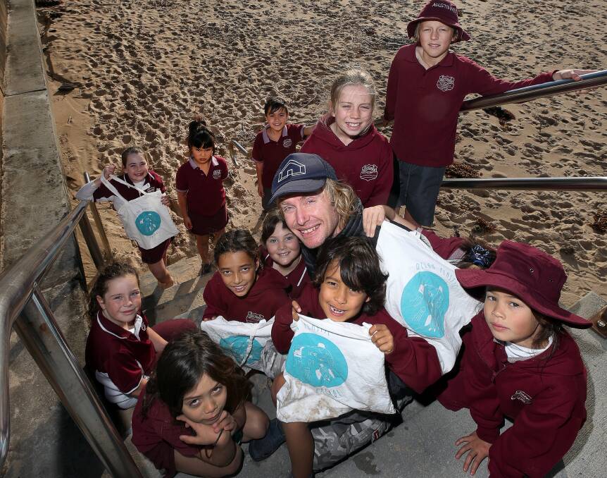The young students (with Dr Paul Hoskins, centre, with cap) at Austinmer are thinking big and learning about doing their bit for the world.