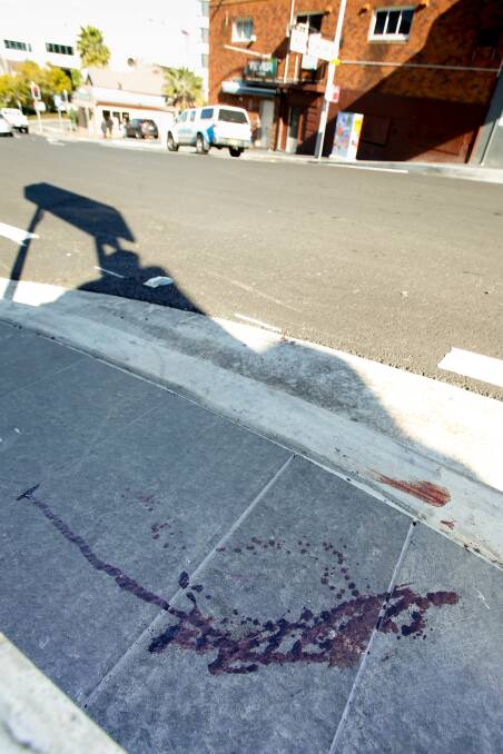 Blood on the footpath near Fever nightclub on Monday morning.