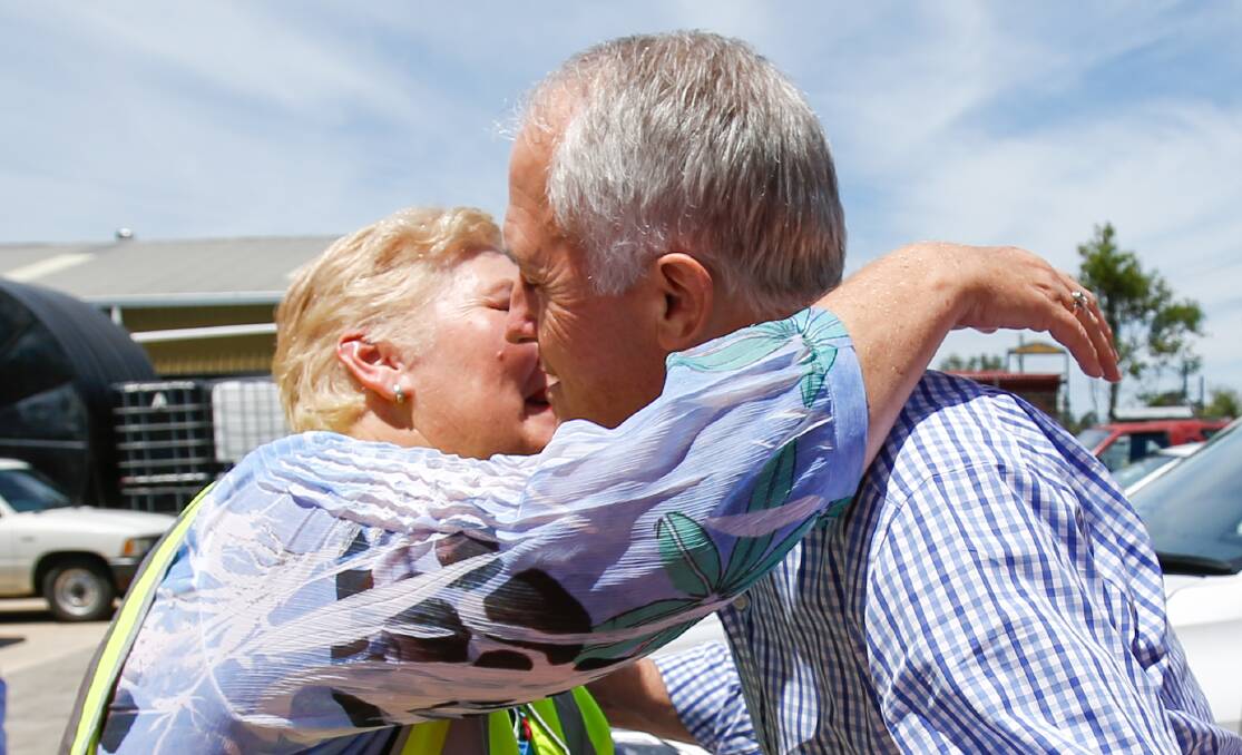 Member for Glimour Ann Sudmalis embraces Prime Minister Malcom Turnbull during a visit to Nowra in February. Photo: Adam McLean