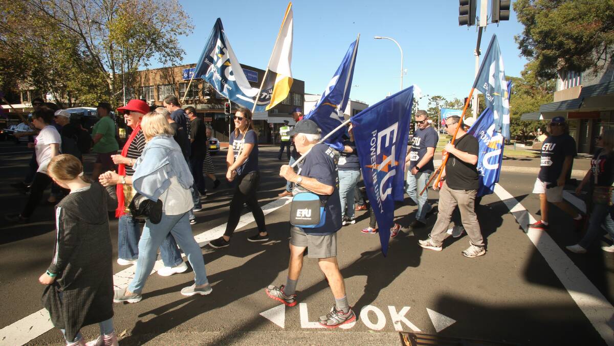 Protesters march to Crown Street in Wollongong during a part May Day rally.