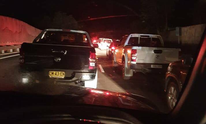 Josh Hermann captured this image of traffic at a standstill on Mount Ousley Road early Sunday morning. Photo: Facebook