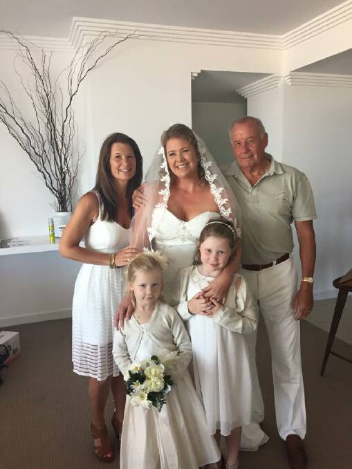 Kelly surrounded by family on her wedding day, just after she was diagnosed with breast cancer. Kelly and her husband, Matt, have been together since university, and felt compelled to get married when the diagnosis came through. 