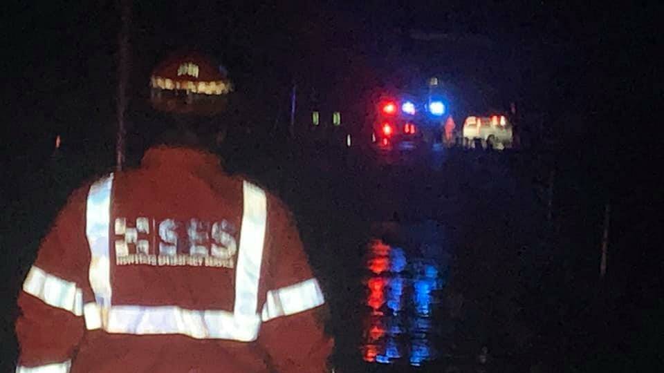 A tabletop truck was caught in rising floodwaters overnight on Swamp Road with the water up to the windows of the vehicle, and the occupants unable to drive out. Photo: Kiama SES