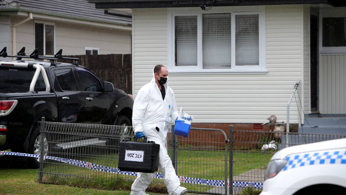 Forensics investigators at the Thomas Street home in August. Photo: Sylvia Liber