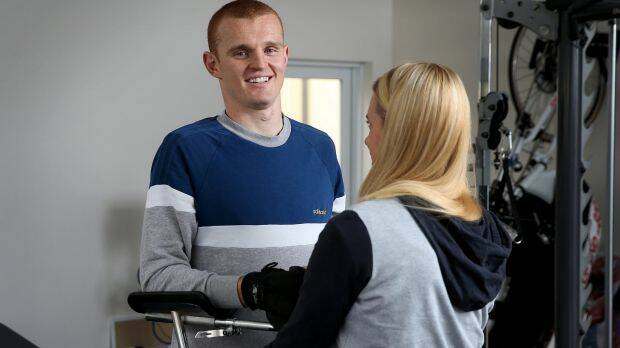 Anger is gone: Knights physio Pip Cave helps Alex McKinnon with his rehab. Photo: Marina Neil
