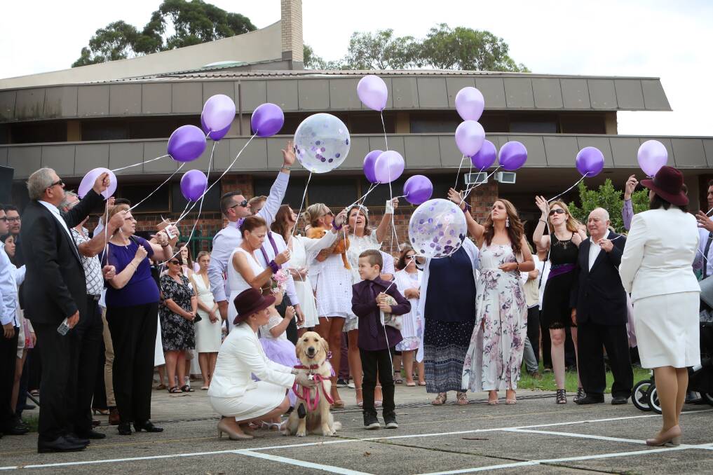 Purple balloons are released into the air in honour of brave little Kalani. Photo: Sylvia Liber