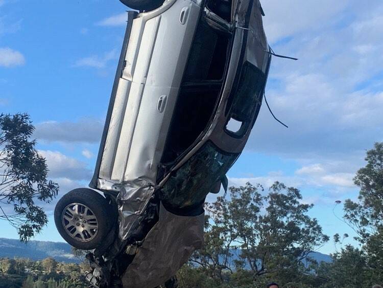 Car plummets down cliff at Nowra Showground, narrowly missing bushwalker