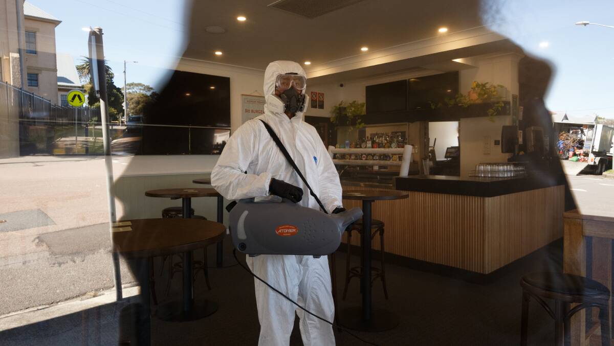Cleaning crew fumigates a room as part of a deep clean of the Bennet Hotel pub in Hamilton in August. Wednesday, August 6, 2020. Picture Max Mason-Hubers