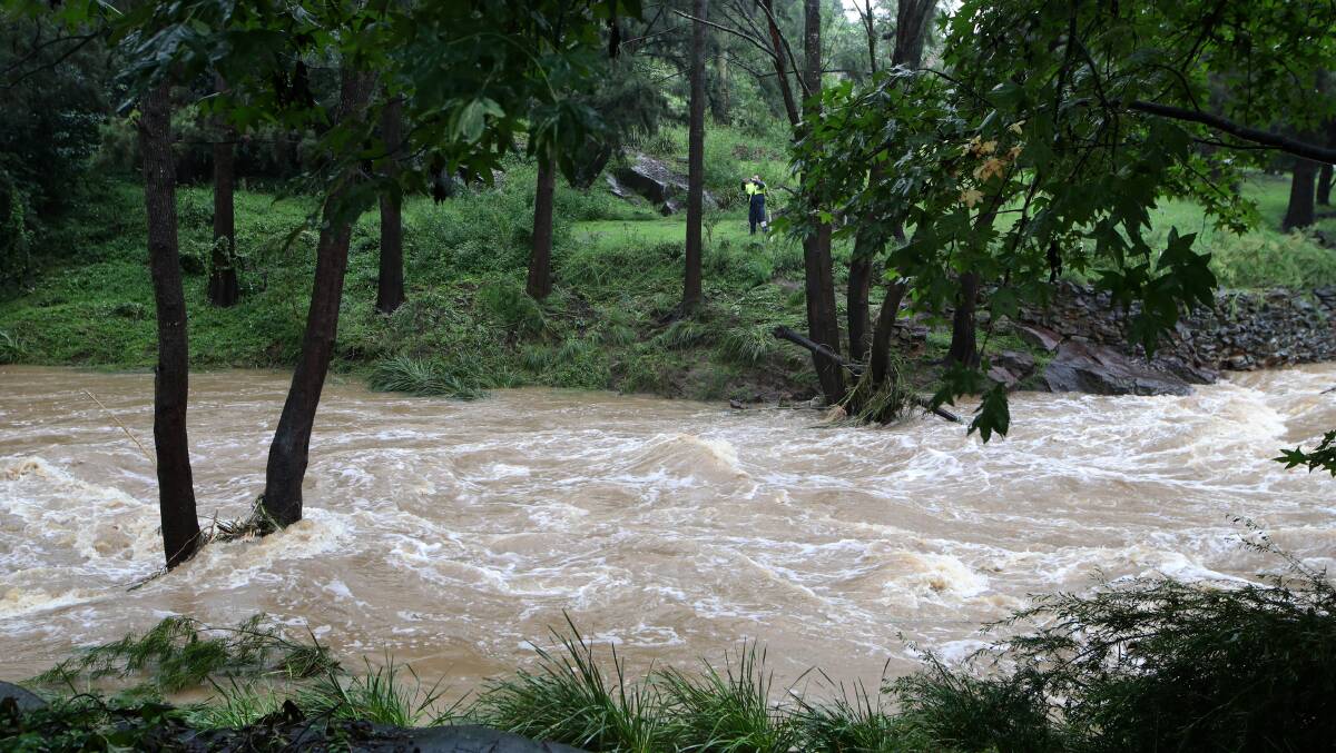 A flooded creek at Picton on Sunday. Picture: Sylvia Liber