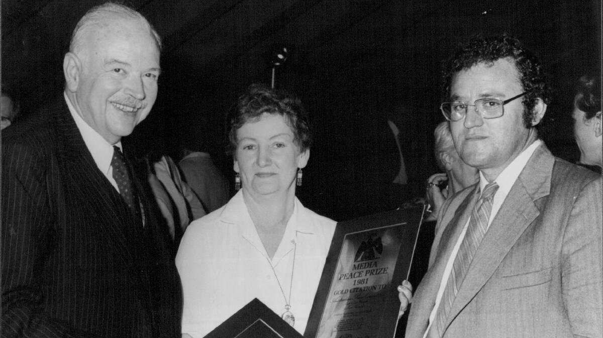 Australia Media Peace Prize award ceremony October 25, 1981: Dr Hugo Idoyaga of the United Nations High Commission for Refugees presents a Gold Citation to the Australian Peace Committee South Coast's Doreen Borrow and Mercury editor Peter Newell. 
