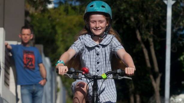 Macy will have to stop riding on the footpath when she turns 12 under NSW law. Photo: Fiona Morris
