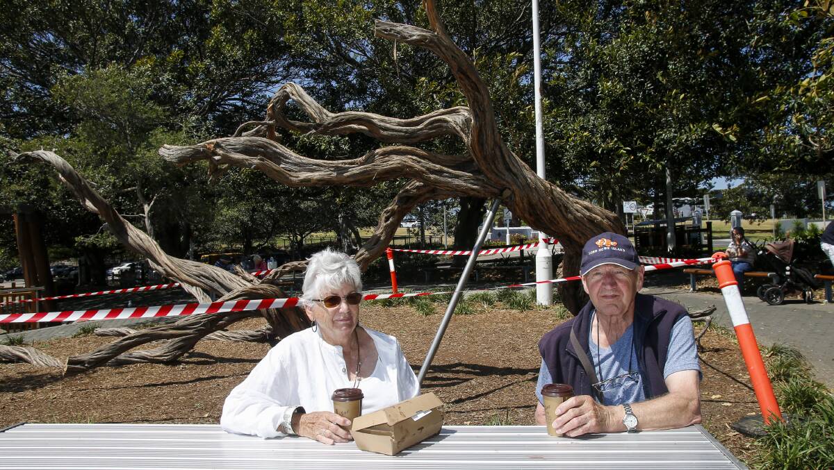 Pam and David Smith of Thirroul sitting in full sun where there would normally be shade from the tea trees. 