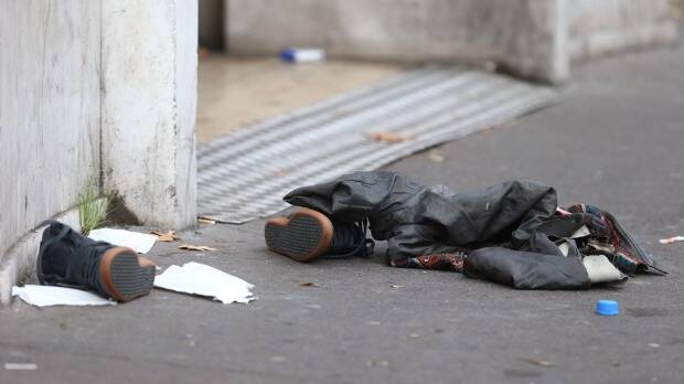 Discarded shoes outside the Bataclan theatre. Photo: Andrew Meares