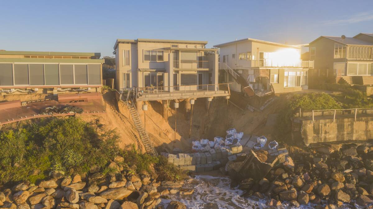 Homes teeter on the edge at Wamberal after heavy weekend seas. Picture: Klayte McSweeny