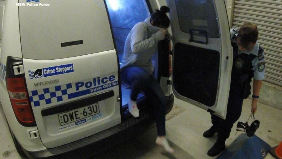 Co-accused Deanna Struber is taken into police custody. Photo: NSW Police