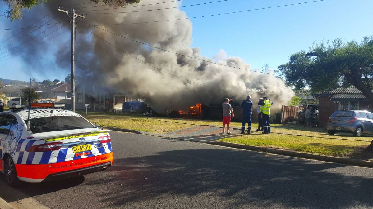 The property alight at Kimbarra Crescent in Koonawarra on Sunday morning. Photo: supplied