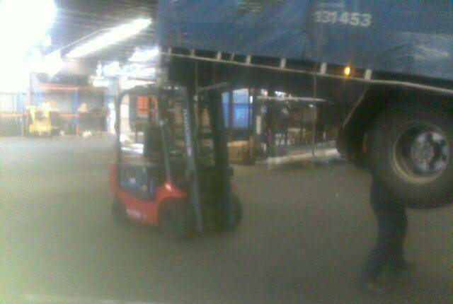 A picture provided to the union two years ago shows a man working beneath a Barnetts truck propped up on a forklift.