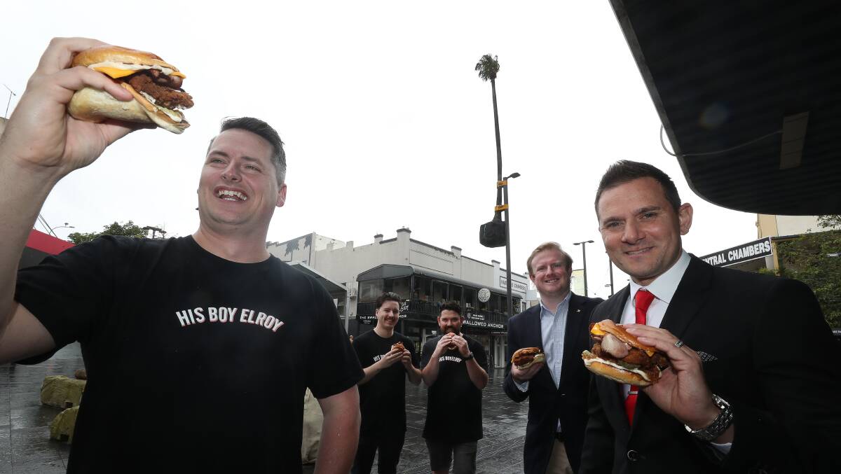 His Boy Elroy owner Lachlan Steven, left, last week launched a "palm up a pole" burger, with all funds raised to go towards rehoming the cabbage tree palms.