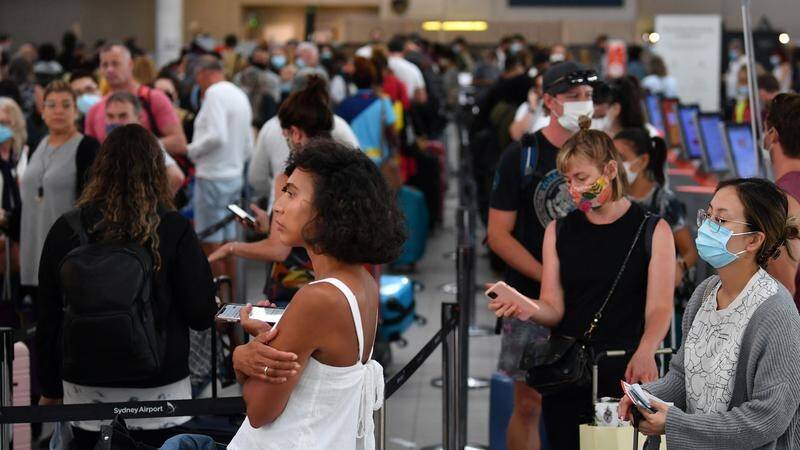 Travellers queued at Sydney's domestic airport in a race to beat interstate border restrictions.