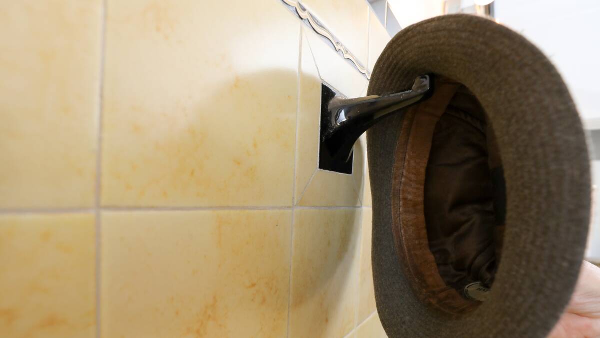 "There's a black ceramic holder above the toilet where you put your hat on."