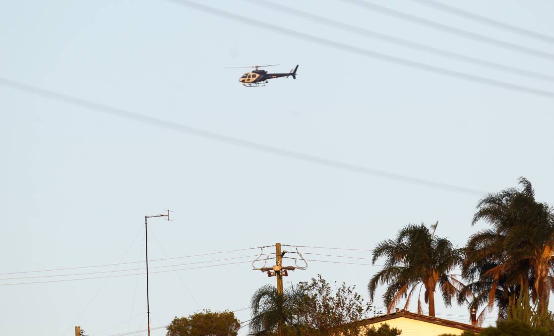 A Polair chopper searched from above on Monday afternoon. Picture: Adam McLean
