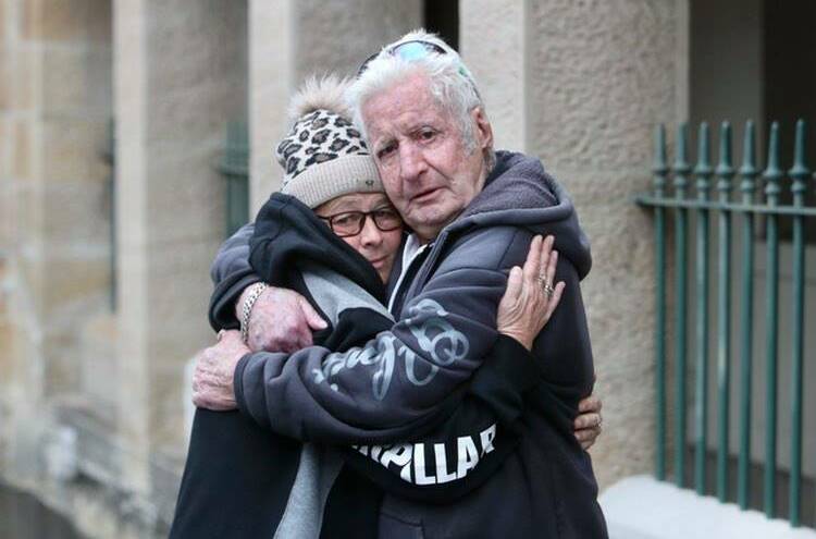 Nathan Costello's loved ones embrace outside after the sentencing. Picture: Adam McLean