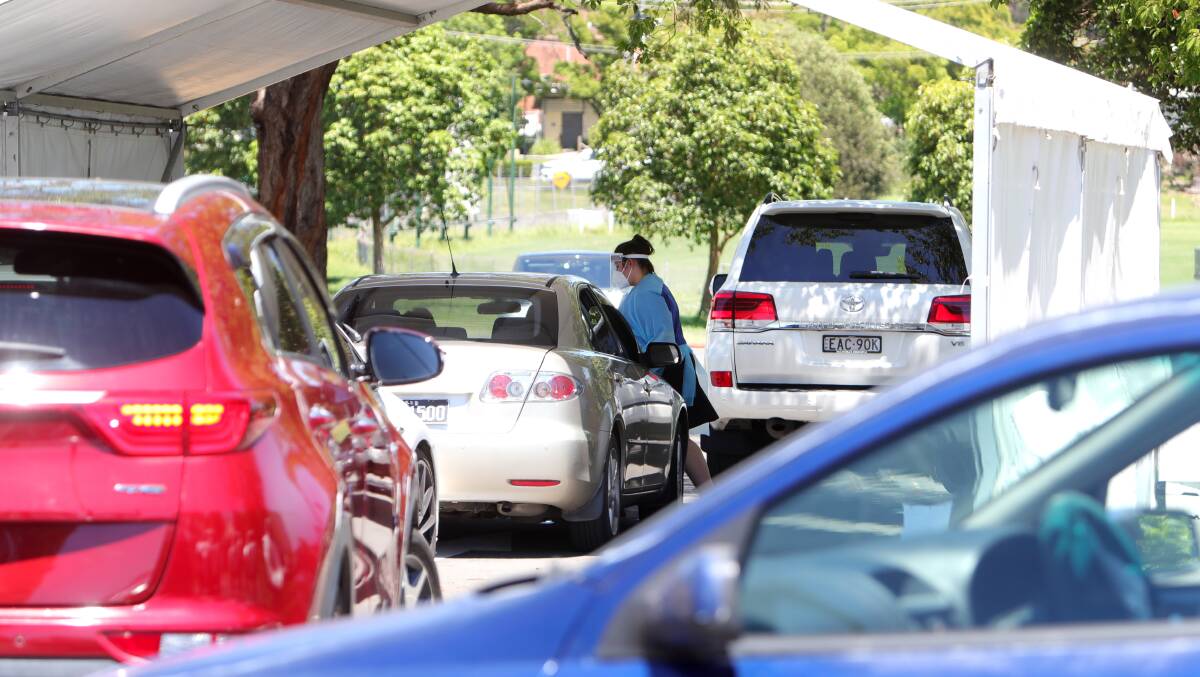 Cars wait in long lines to get tested at Illawarra drive-through clinics. Photo: Sylvia Liber