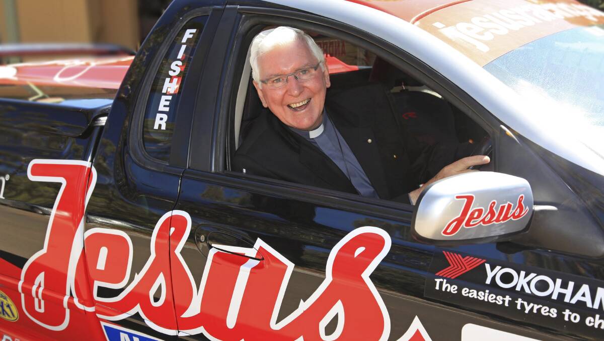 Bishop Ingham behind the wheel of V8 Supercar driver Andrew Fisher's race car as part of the Jesus All About Life campaign.