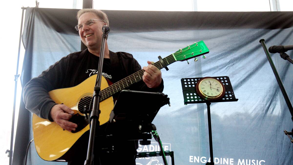 Strung out: Scott Burford wraps up his Guinness World Record play at Engadine Music. Picture: Chris Lane