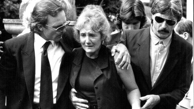 Peter and Christine Simpson are supported by friends and family as they leave the Bowral local court in 1993.  Photo: Troy Howe
