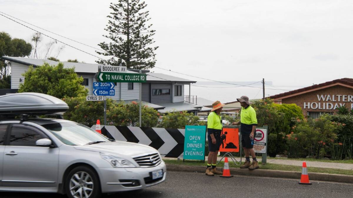 Traffic controllers, parking rangers and council workers are stationed throughout the village to help manage congestion. Photo: Louise Kennerley

