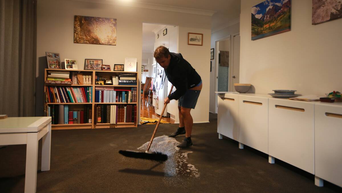 Peter Moxey of Henry Lee Drive in Gerringong mopping up. 