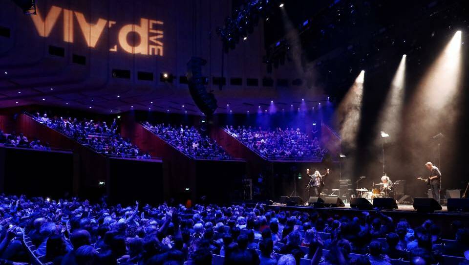The Dirty Three perform in front of a packed crowd at the Sydney Opera House as part of the VIVID Festival in 2019.