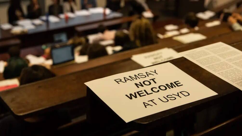 A sign from a meeting of Sydney University staff opposed to a partnership with the Ramsay Centre.