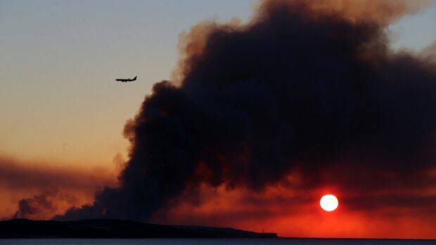 Smoke from a bushfire near Kurnell earlier this week, not far from Sydney Airport. Photo: John Veage

