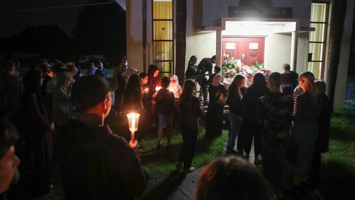 The candlelight vigil outside Omar Mosque at Gwynneville on Saturday. Photo: Adam McLean