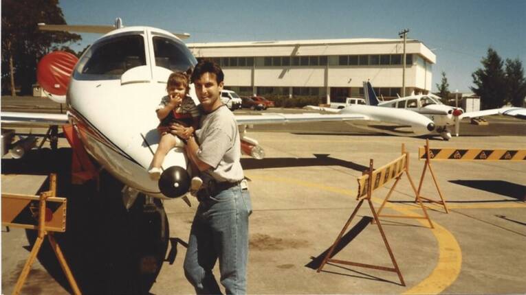 Tori with her pilot father, Tony Nikolaou, when she was a young child in Wollongong.